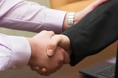 two businessman shaking hands two businessman shaking hands